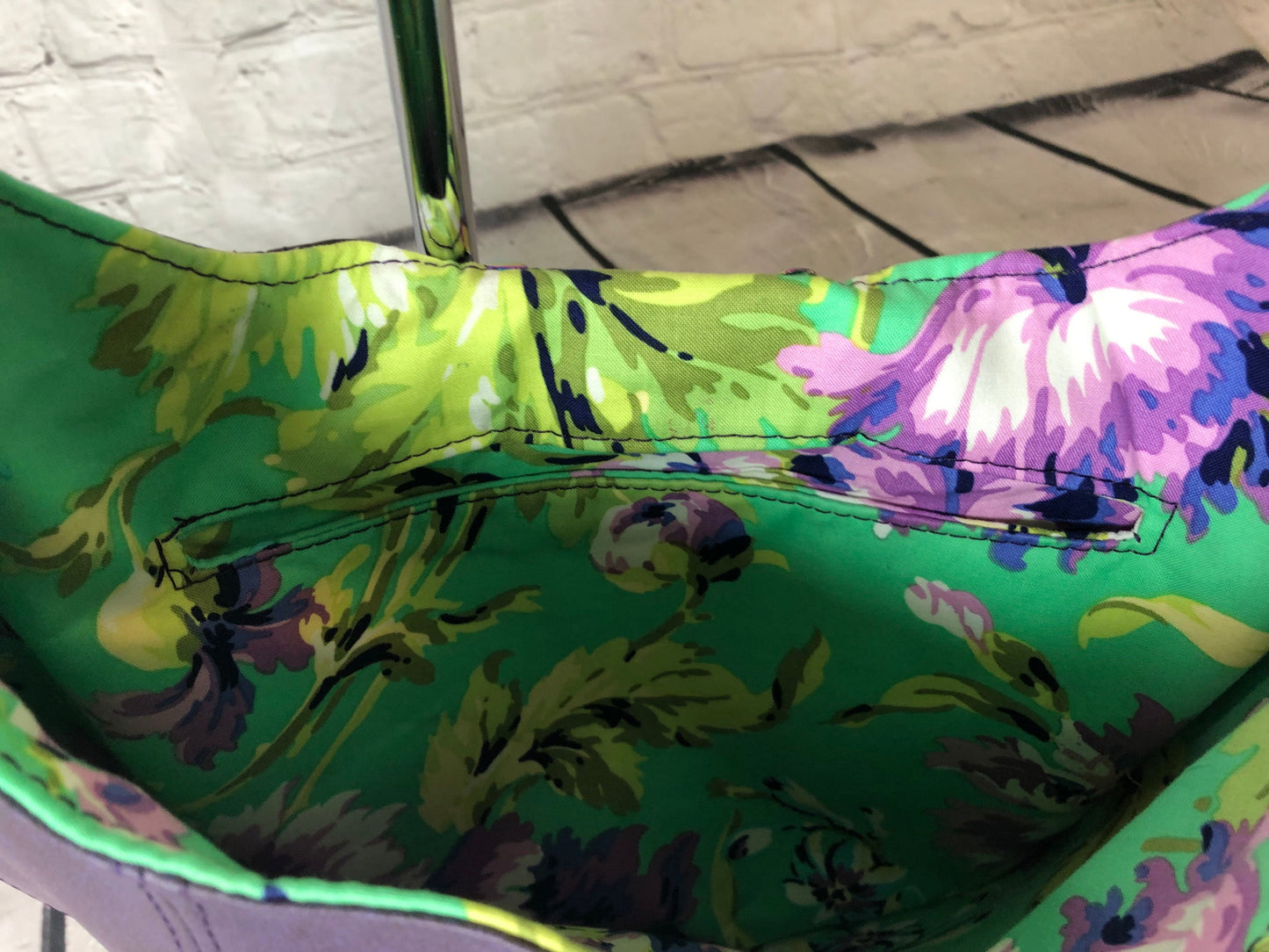 green and purple interior with slotted slip pocket