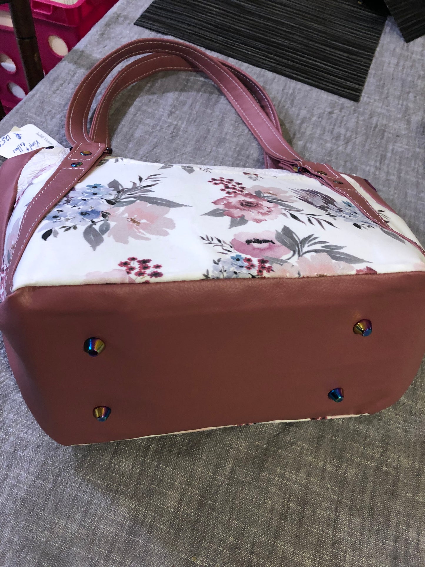 beautiful one of a kind handbag/shoulder bag with extra crossbody strap. This bag has two exterior slip pockets with additional pockets on the inside. There is also a zipper pocket inside There is also attached keyfob on the inside so you will never loose your keys.