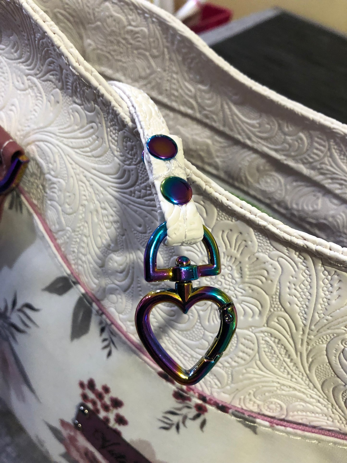 beautiful one of a kind handbag/shoulder bag with extra crossbody strap. This bag has two exterior slip pockets with additional pockets on the inside. There is also a zipper pocket inside There is also attached keyfob on the inside so you will never loose your keys.