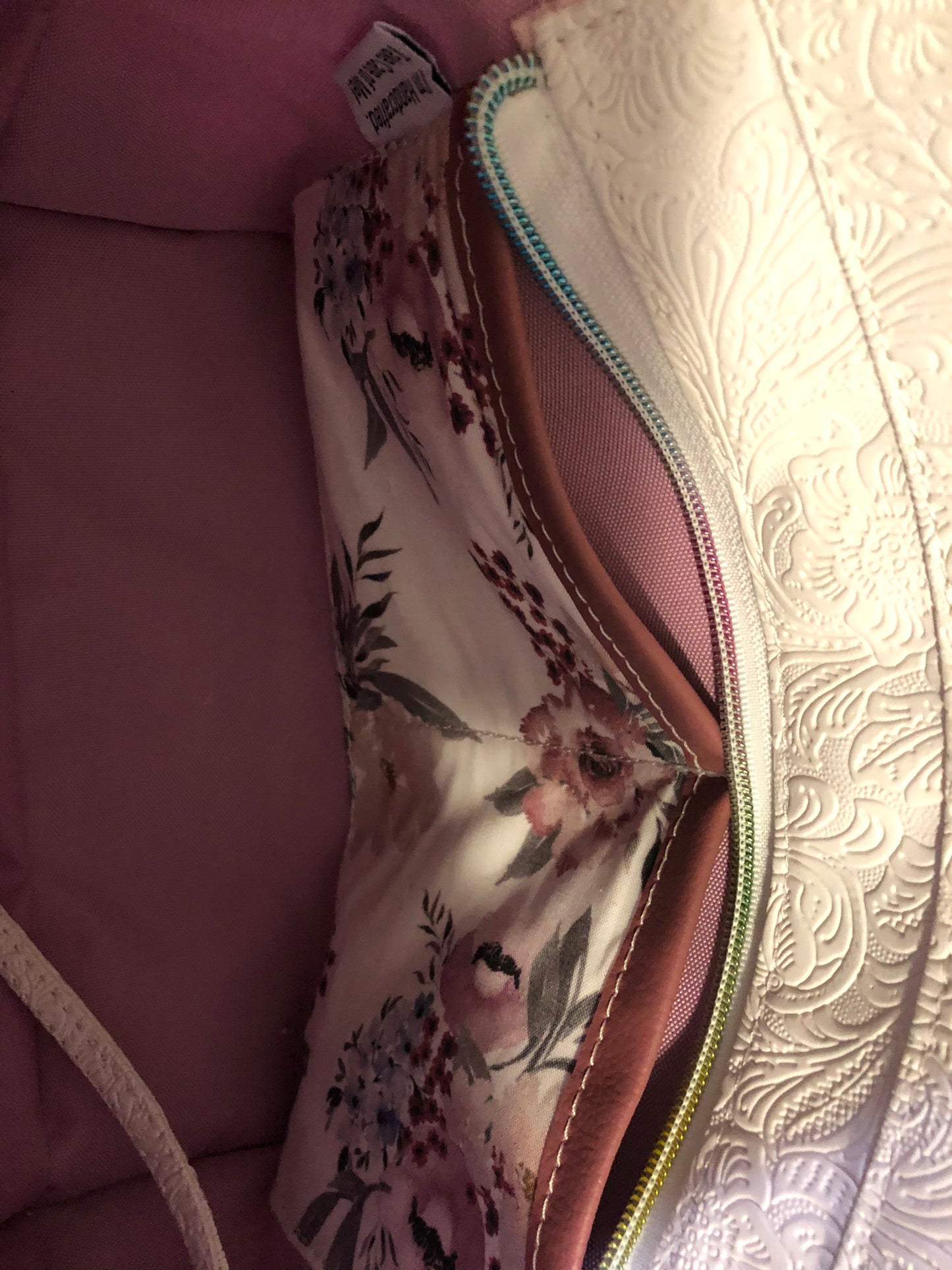 beautiful one of a kind handbag/shoulder bag with extra crossbody strap. This bag has two exterior slip pockets with additional pockets on the inside. There is also a zipper pocket inside There is also attached keyfob on the inside so you will never loose your keys.