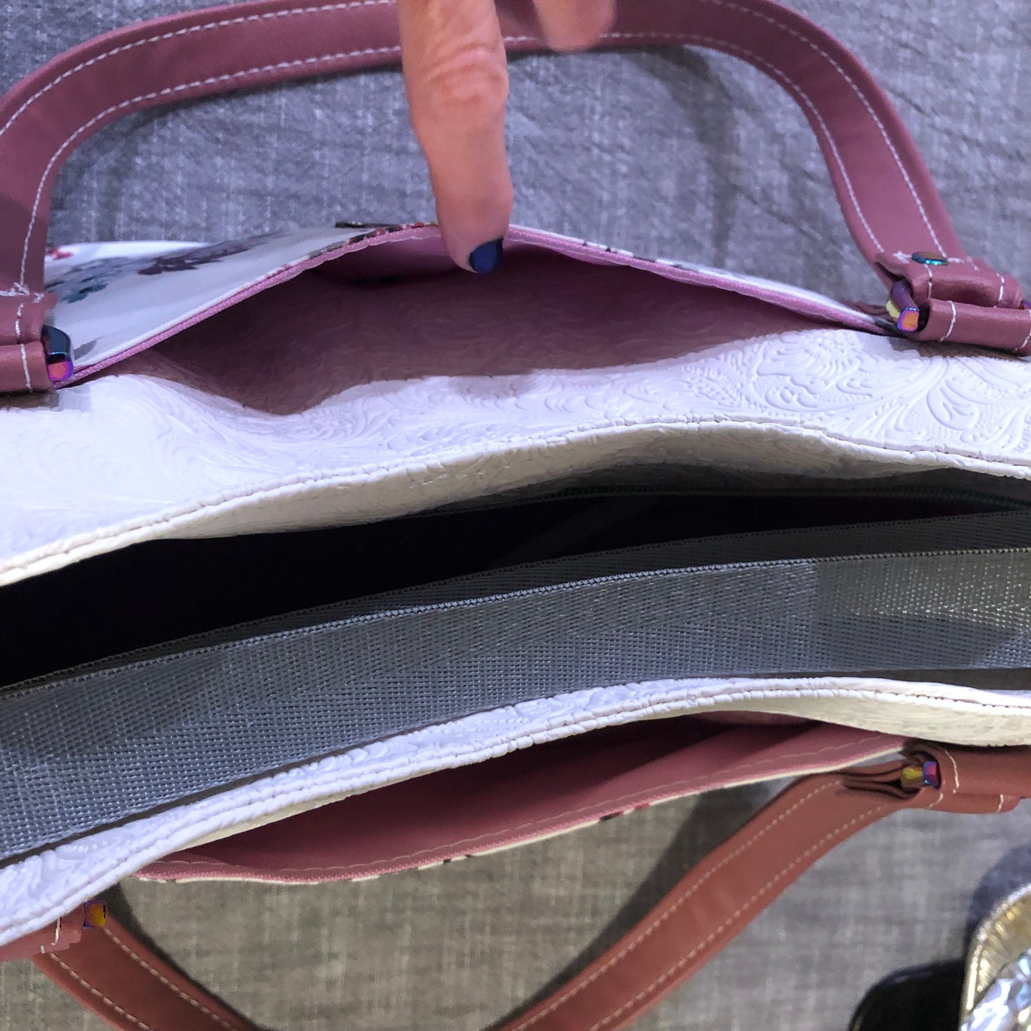 beautiful one of a kind handbag/shoulder bag with extra crossbody strap. This bag has two exterior slip pockets with additional pockets on the inside. There is also a zipper pocket inside There is also attached keyfob on the inside so you will never loose your keys.
