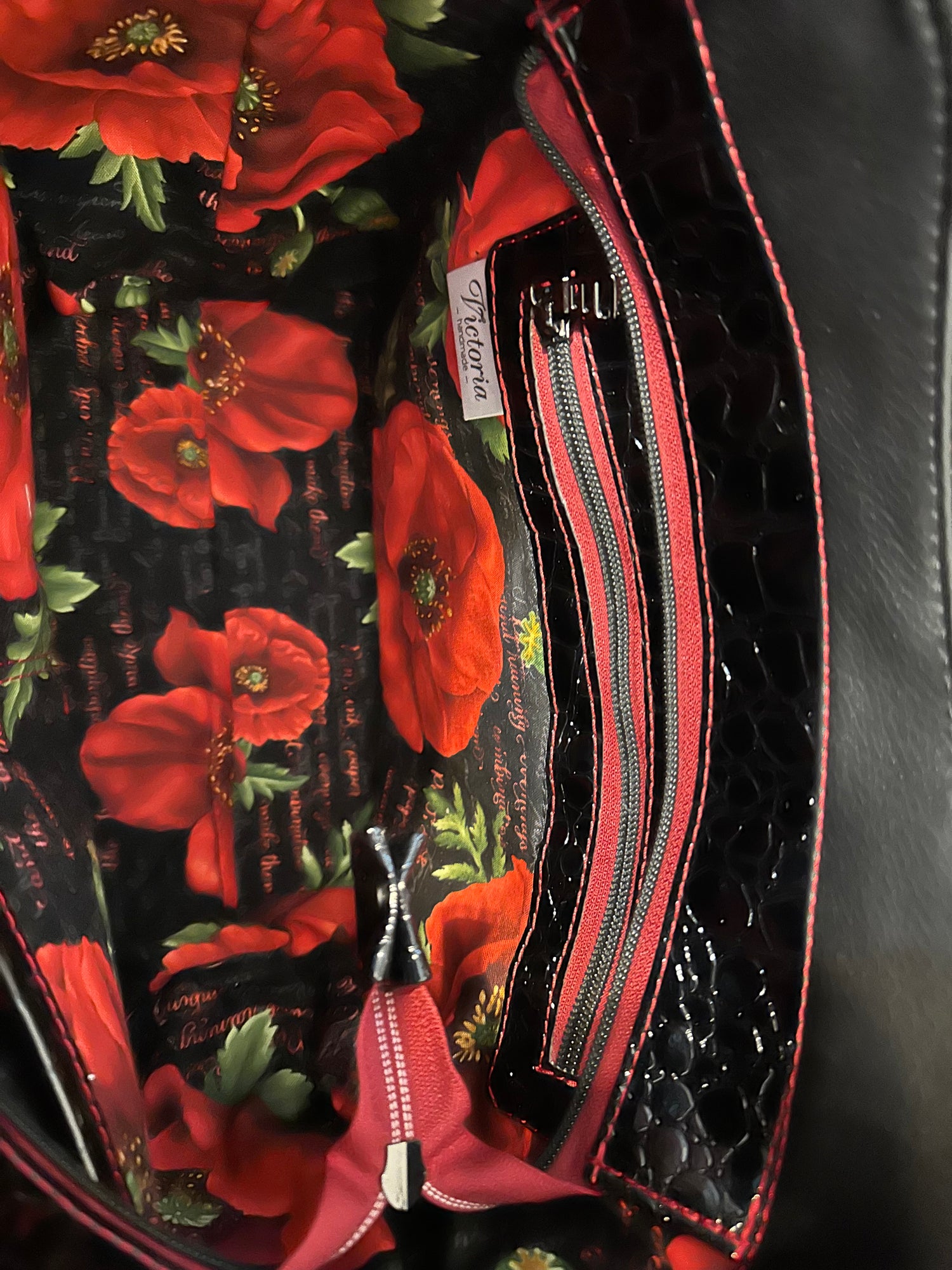 Black handbag on sale with red inside