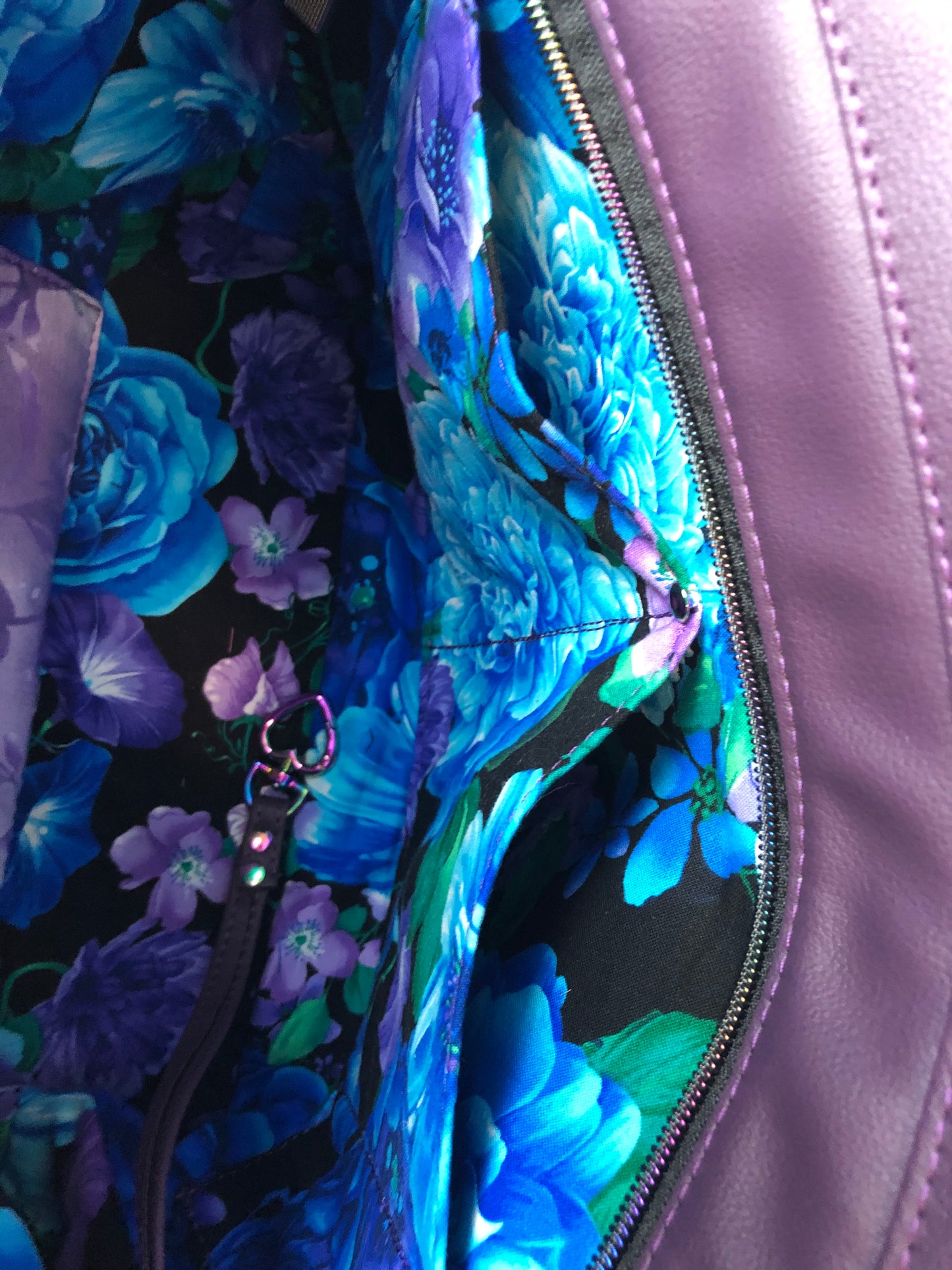 Everyday tote shoulder bag in purple crockadail. Rainbow hardware, recessed zipper.   Double slip on one side and zipper pocket on the other.