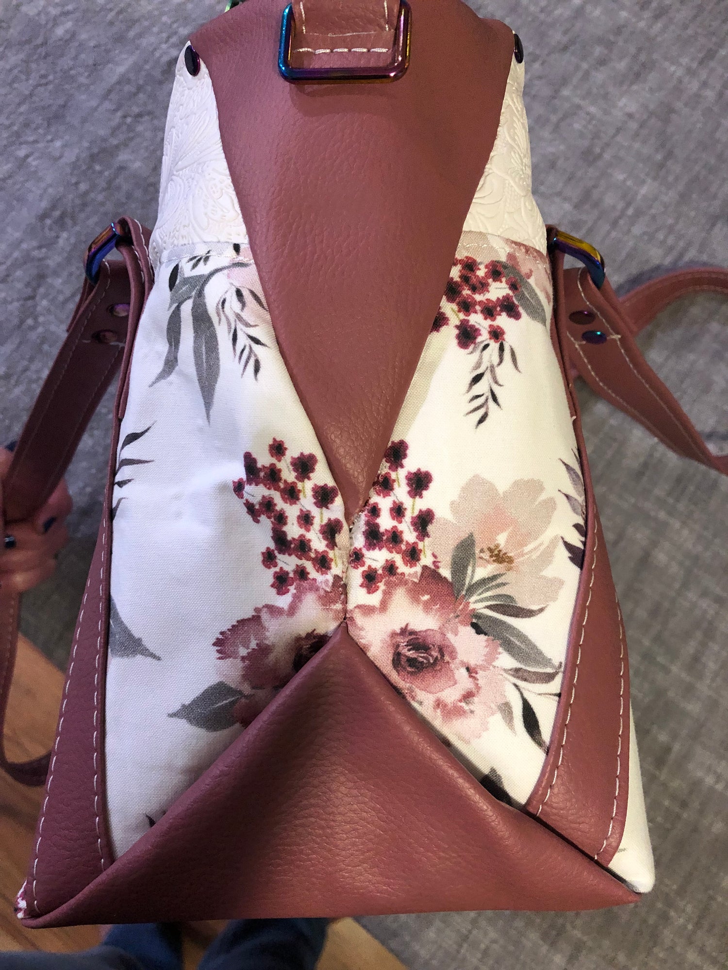 beautiful one of a kind handbag/shoulder bag with extra crossbody strap.  This bag has two exterior slip pockets with additional pockets on the inside. There is also a zipper pocket inside  There is also attached keyfob on the inside so you will never loose your keys.