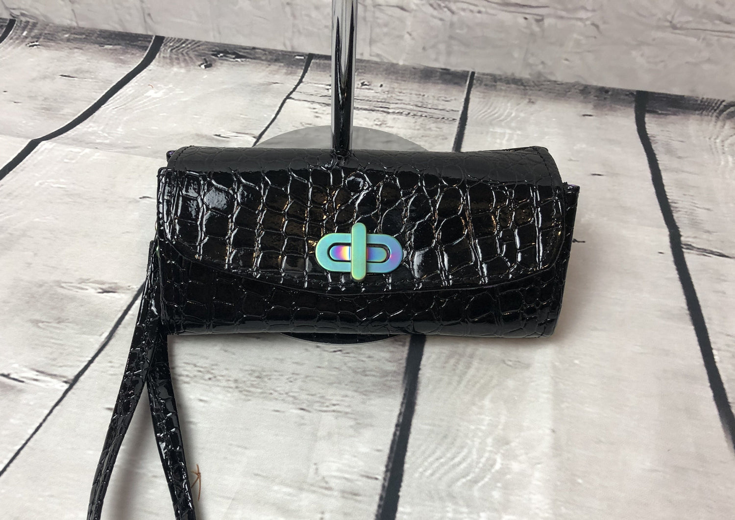 Black crocodile wallet with rainbow hardware twist lock and rivets. The interior is made with quality floral cotton fabric in beautiful purple and blue flowers.  