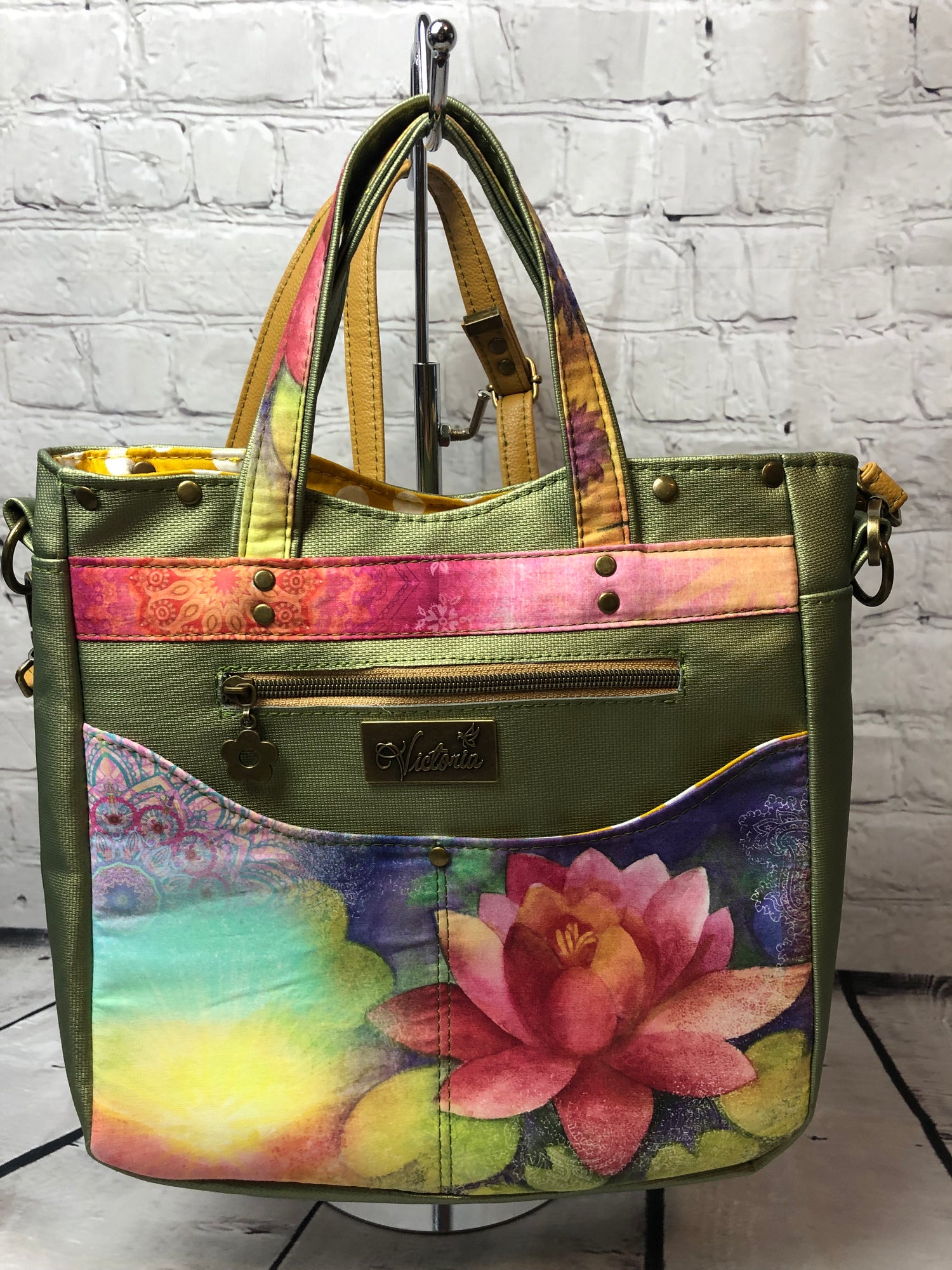 Lotus flower on the front with a zipper pocket and 2 additional slip pockets