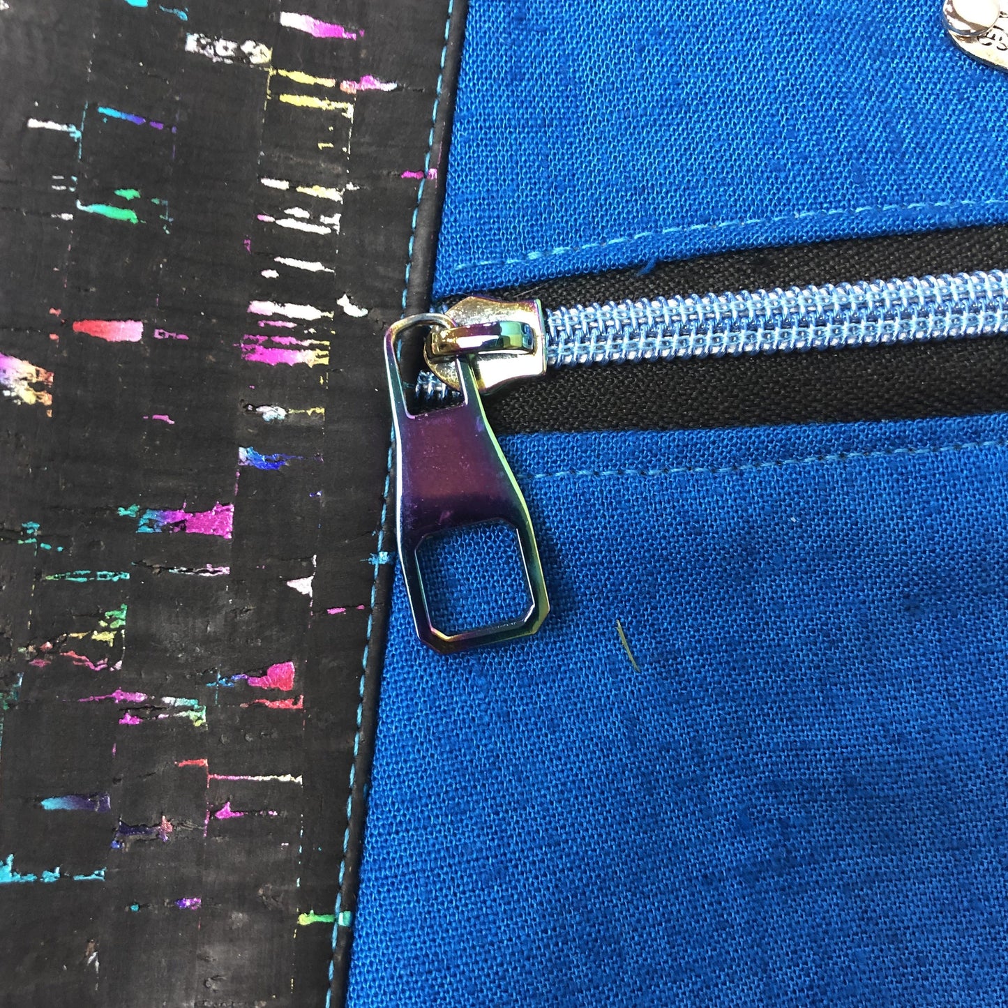 beautiful rainbow colors in this cork fabric trim. Rainbow zipper pull.