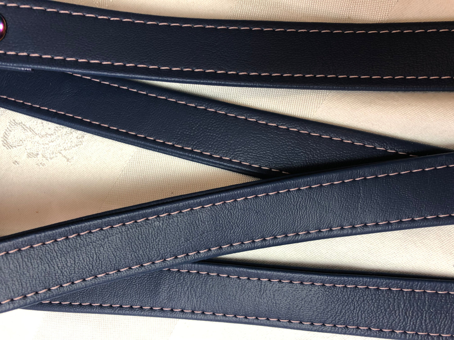 Pink top stitching on Navy vinyl trim