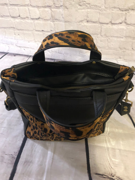 Back of handbag. Showing off two tone handles.