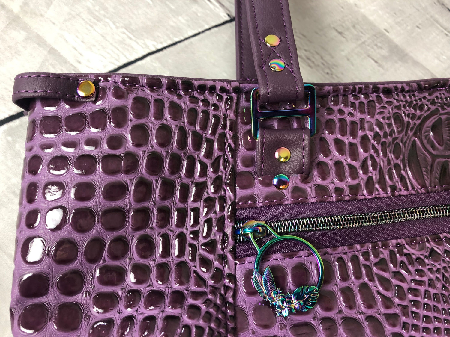 Everyday tote shoulder bag in purple crockadail. Rainbow hardware, recessed zipper. Sunglass loop