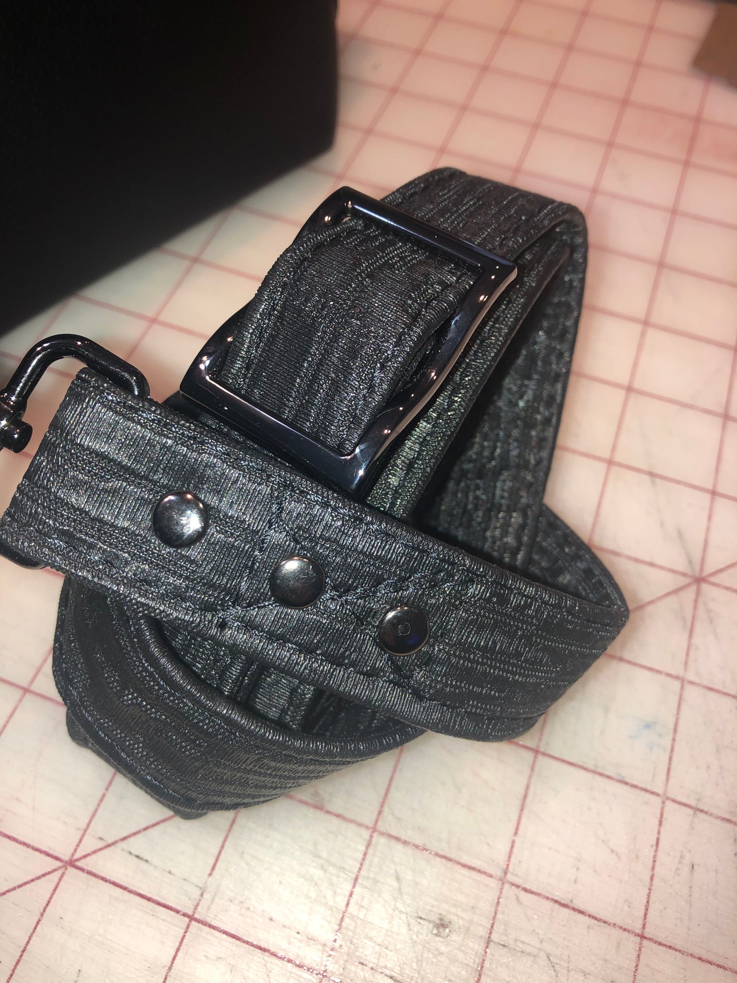 Crossbody strap with extra wide slider buckle for ease of adjustment.