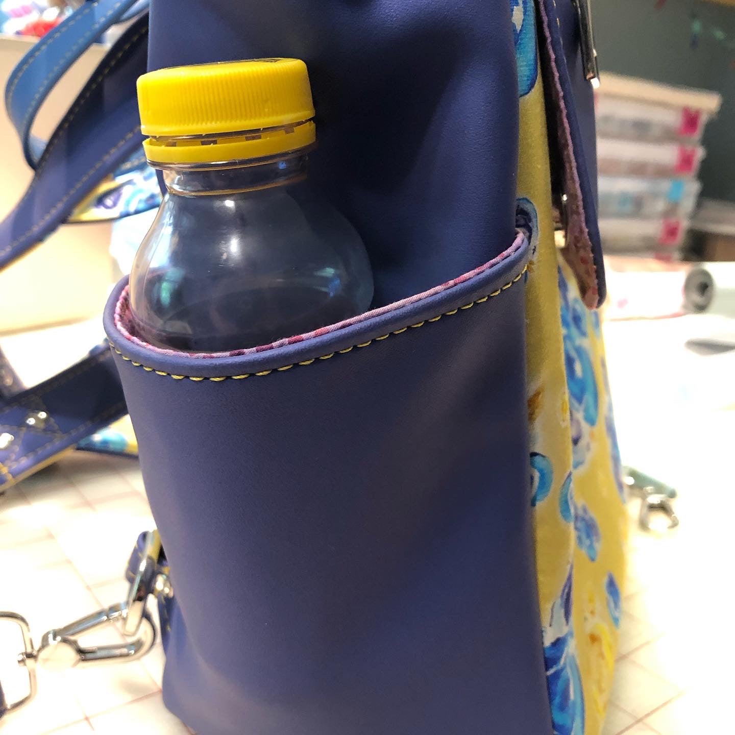 Side exterior pockets will hold a small water bottle