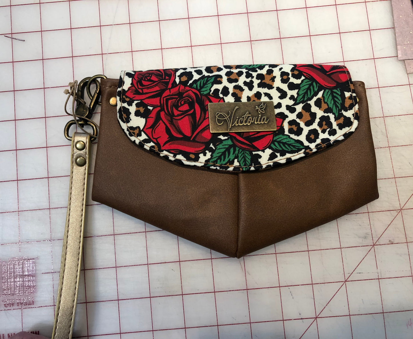 Small tan rose clutch wristlet