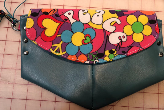 Peace clutch wristlet