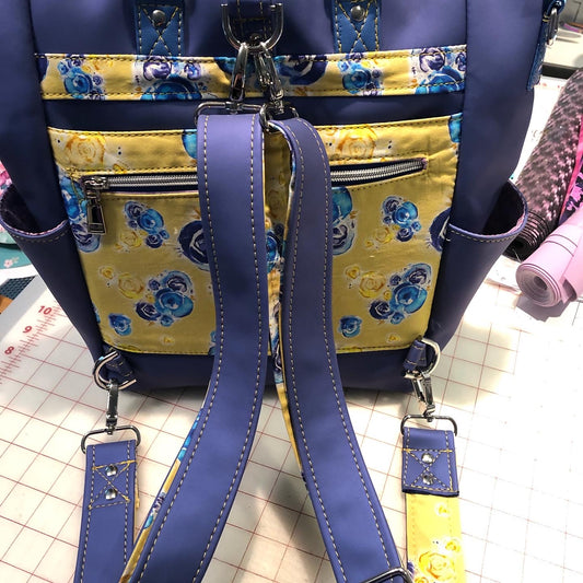 This is the back of the bag. Extra wide straps for comfort on the shoulder. Two tone straps of fabric and vinyl.